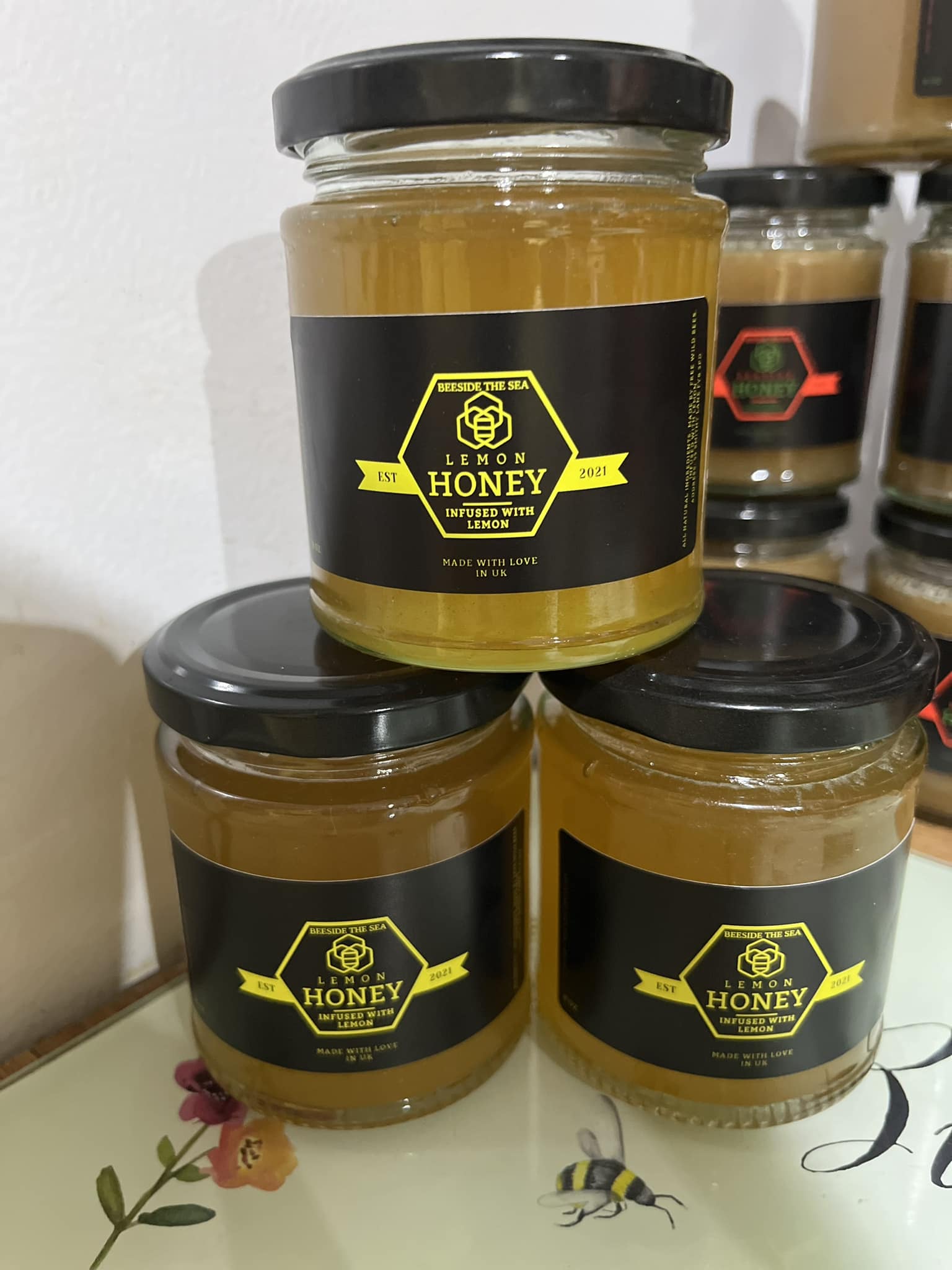 Pouring fresh raw honey straight from the extractor into jars